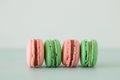 Image of romantic colorful macaron or macaroon over pastel background.