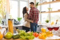 Image of romantic couple at home. Attractive young woman and handsome man are enjoying spending time together while standing on Royalty Free Stock Photo