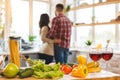 Image of romantic couple at home. Attractive young woman and handsome man are enjoying spending time together while standing on Royalty Free Stock Photo