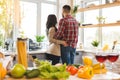 Image of romantic couple at home. Attractive young woman and handsome man are enjoying spending time together while standing on Royalty Free Stock Photo