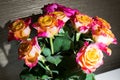 Close-up of festive fresh roses with original yellow and crimson coloration.