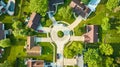 Roof view of cul-de-sac houses in low to middleclass neighborhood with landscaping aerial