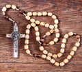 Rosary beads on a table in the church Royalty Free Stock Photo