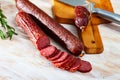 Image of russian smoked sausage cut in slices, close-up