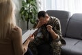 Image of sad soldier having support of his private therapist