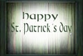 Image for Saint Patrick`s Day on March 17th. A green wooden frame surrounds a green wooden background. Message added.