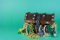 Image for Saint Patrick`s Day on March 17th. Treasure chest to symbolize luck and wealth is filled with costume jewelry and beads.