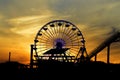 Ferris Wheel With Sunset In The Background