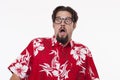 Image of a scared young man in Hawaiian shirt standing against w Royalty Free Stock Photo