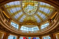 Sculpture under Rotunda stained glass ceiling with balcony view