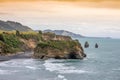 sea shore rocks and mount Taranaki, New Zealand Royalty Free Stock Photo