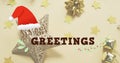 Image of seasons greetings text over christmas decorations Royalty Free Stock Photo