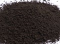 An image select focus isolated close-up heap dark coffee ground as roast dry for an instant a hot drink with food on white Royalty Free Stock Photo