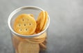 An image selected focus circle crackers or snack or biscuits in plastic cans treat gourmet or junk food falling and cracking on Royalty Free Stock Photo