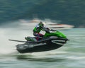 An image selective focus jet ski flying in the sea