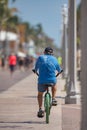 Image of a senior man riding a bike on Hollywood Beach FL