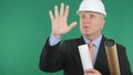 Image with Serious Engineer with Plans and Projects Making Hand Gestures