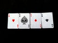 Set of four aces playing cards suits. Winning poker hand isolated on black background Royalty Free Stock Photo