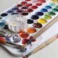 image of Set of watercolour paints and paintbrushes generative AI Royalty Free Stock Photo