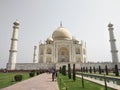 Image of seven wonder of world the Taj Mahal located in Agra. White marble indian beautiful Mughal monument surrounded by tourists