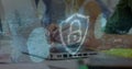 Image of shapes, padlock and fingerprint over diverse business people using laptops in office