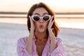 Surprised young pretty girl walking outdoors at the beach Royalty Free Stock Photo