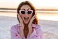 Surprised young pretty girl walking outdoors at the beach Royalty Free Stock Photo