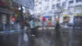 Image shot through raindrops falling on wet glass,abstract blurs of traffic - monsoon stock image of Kolkata formerly Calcutta Royalty Free Stock Photo