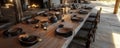 This image showcases a beautifully arranged rustic wooden dining table set, adorned with neutral-toned dinnerware and flickering Royalty Free Stock Photo