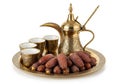 Traditional arabic coffee set with dates displayed on ornate brass tray Royalty Free Stock Photo