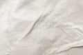 Cloud Dancer fabric texture in a neutral, off-white color with soft folds Royalty Free Stock Photo