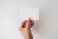 A Person\'s Hand Holding a Blank White Card Royalty Free Stock Photo
