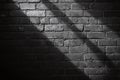 Dark Brick Wall with Shadows Creating an Abstract Pattern in Black and White Royalty Free Stock Photo