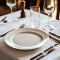 Elegant Dining Table Setting with Empty Plate and Glassware Royalty Free Stock Photo