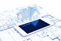 Digital Tablet Displaying BIM Software with Blueprints on Table