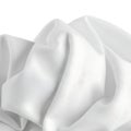 Soft white fabric draped elegantly over a smooth surface Royalty Free Stock Photo