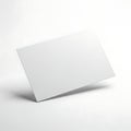 A sleek, minimalist white rectangular card or paper placed on a plain surface Royalty Free Stock Photo