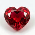A heart-shaped ruby gemstone displayed against a plain background Royalty Free Stock Photo