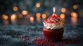 Celebratory Red Velvet Cupcake with a Single Lit Candle for Birthday Bliss Royalty Free Stock Photo