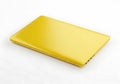 A sleek golden colored rectangular object with a smooth reflective surface on a white background Royalty Free Stock Photo