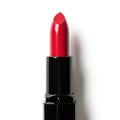 Elegant red lipstick in sleek black packaging against a plain background Royalty Free Stock Photo