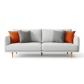 Modern minimalist sofa with neutral and vibrant accent cushions on light wooden legs Royalty Free Stock Photo