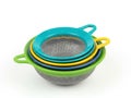 Colorful Stacked Sieves on White Background, Kitchen Utensils Royalty Free Stock Photo