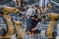Advanced Robotic Arms Assembling Futuristic Exoskeleton