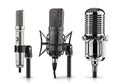 Three classic microphones displayed against a white background Royalty Free Stock Photo