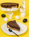 Traditional easter chocolate cake on yellow with easter decoration and easteregg Royalty Free Stock Photo