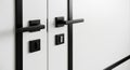 modern white doors with sleek black hardware detail Royalty Free Stock Photo