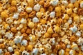 An image showcasing different flavors of popcorn, such as caramel, cheese, and butter, arranged in vibrant and colorful patterns,