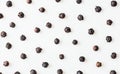 An image showing the diverse textures and colors of black and white peppercorns arranged on a light background Royalty Free Stock Photo