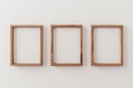 An Image Showing Three Wooden Frames on a White Wall a Mockup of a Frame and a Render in 3D Royalty Free Stock Photo